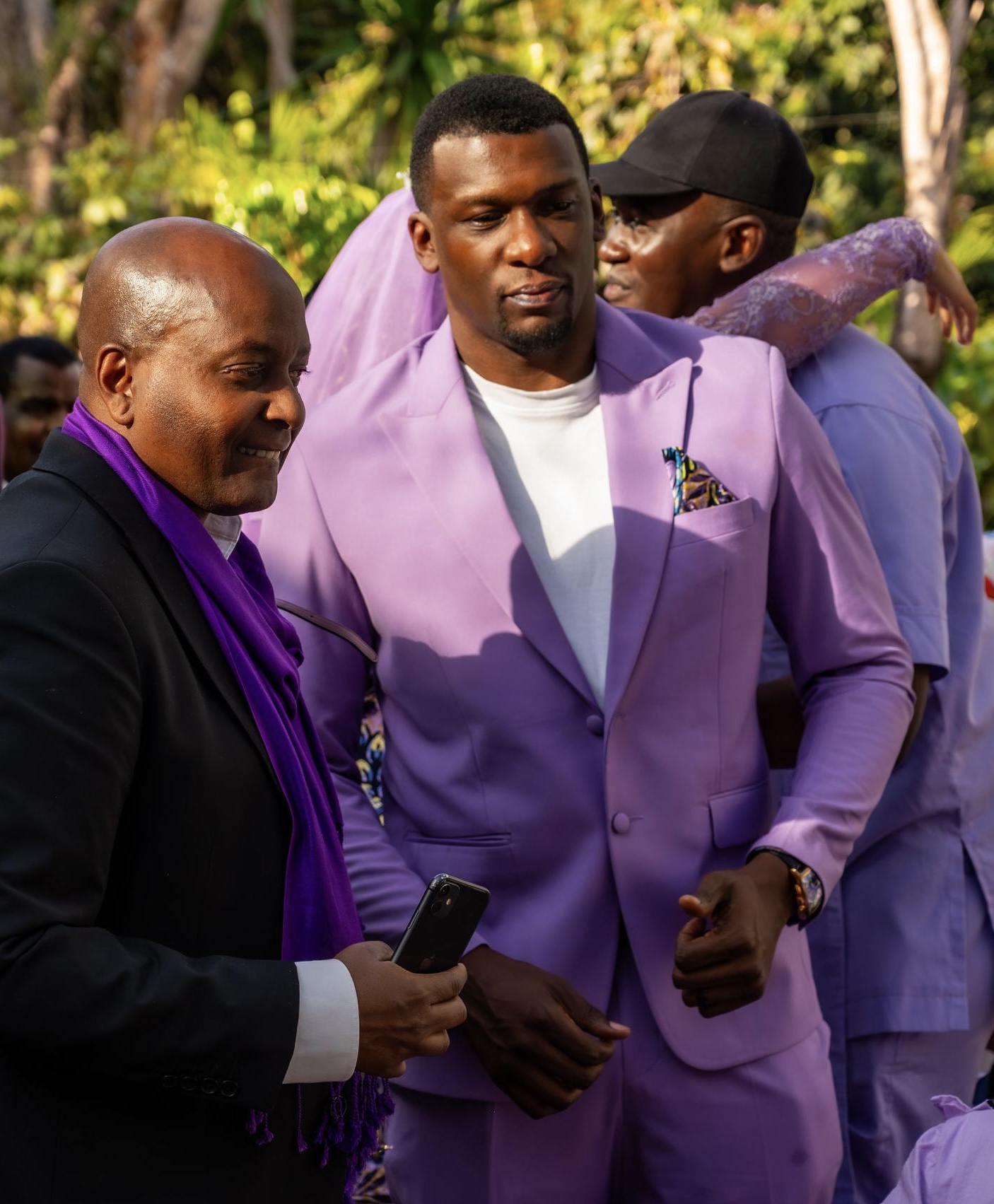 Bidemi Okorodudu in a lilac suit greeting guests at an Africa's Next Super Model event